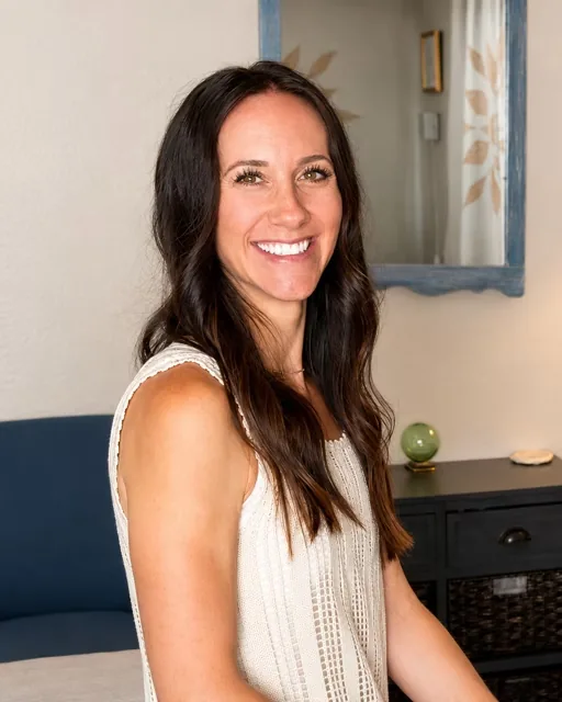 Amy Balaam, CMT, smiling in her Old Roseville massage studio